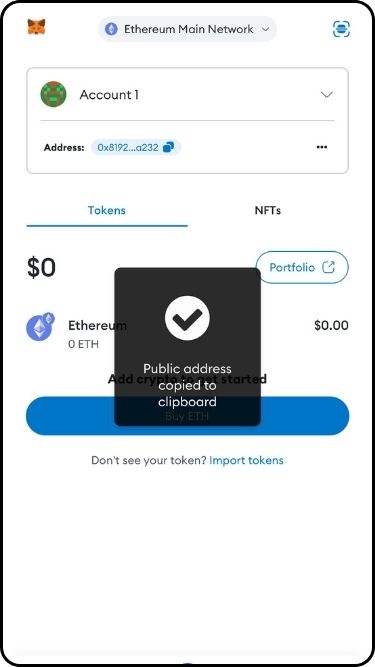 A screenshot of the copy wallet address process on MetaMask iOS