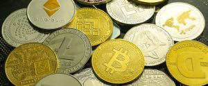 Gold coins representing different cryptocurrencies